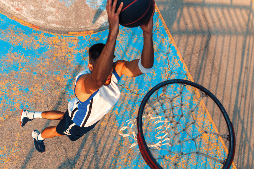 Top,View,Of,Young,Man,Playing,Basketball,Outdoor.,Slam,Dunk.