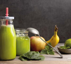 Homemade vegetarian smoothy with the following ingredients spinach,apple, and banana.