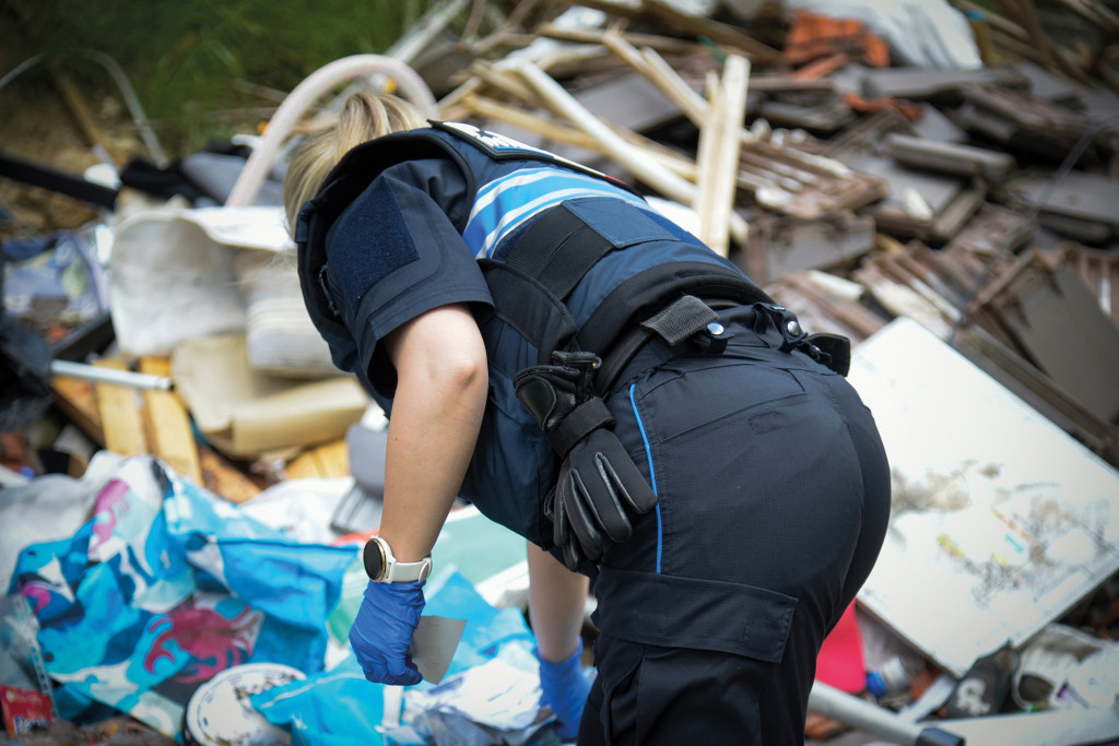 view of police patrol fighting wild depots in rural area in France