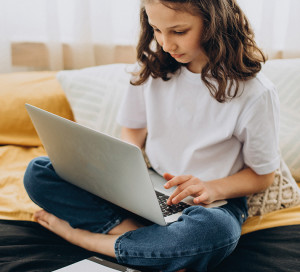 School girl studying at home, distant learning
